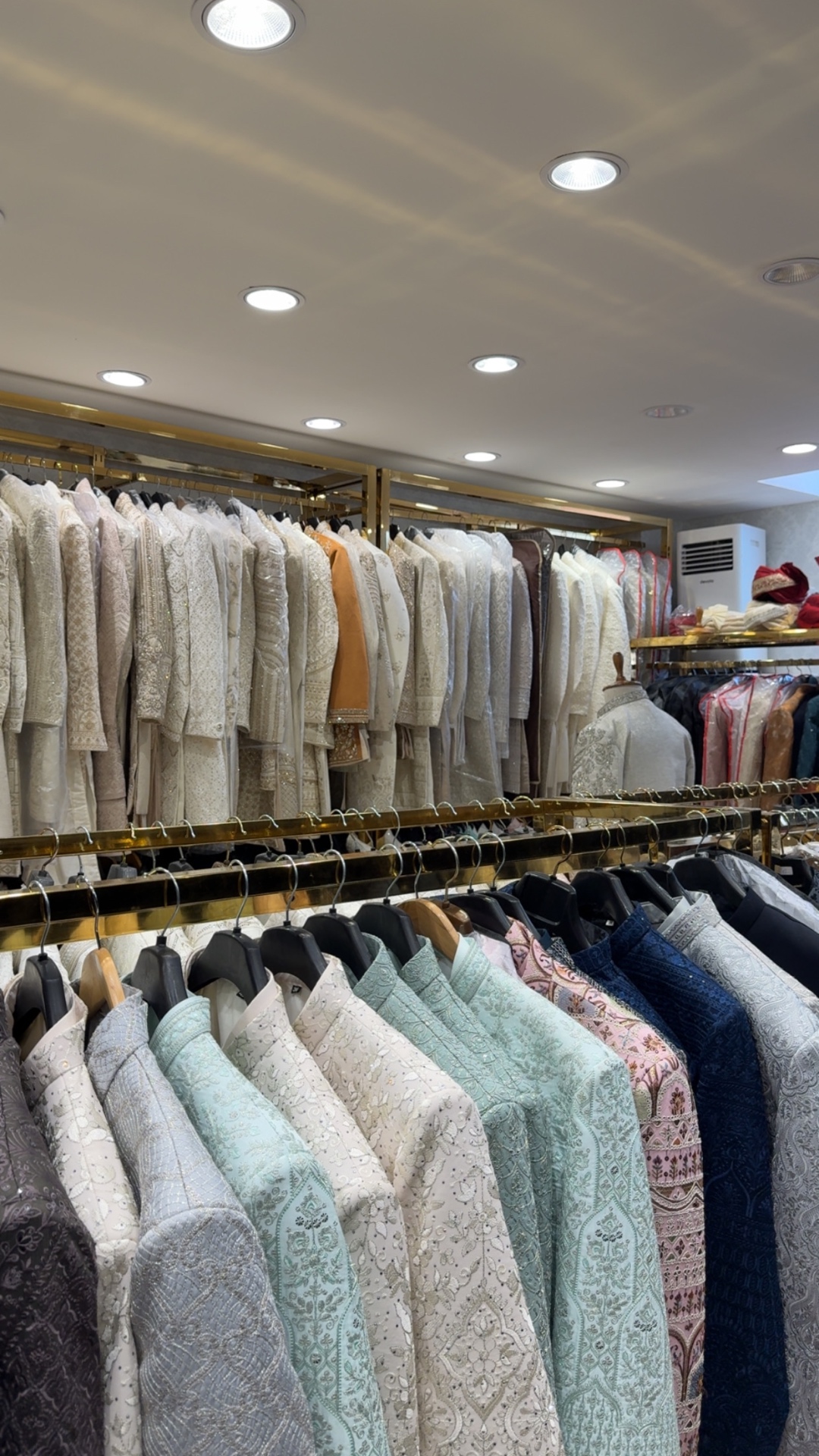 Rails of embroidered sherwanis and prince coats at Nawaab